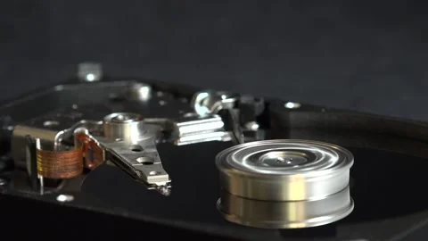 Close-up view of the components of the open hard drive in rotation, in detai Stock Footage 293906891