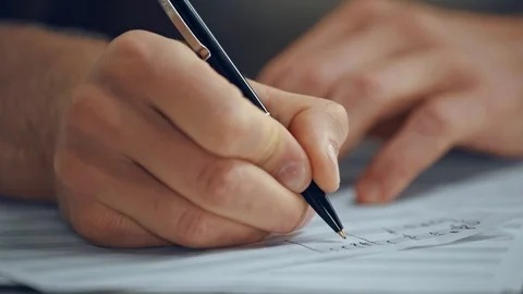 Close up view of composer writing notes on music sheet Stock Footage 115721814