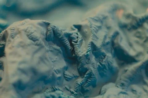A close-up view of the compressed wrinkled rubber of a blue sea color with a  Stock Photos