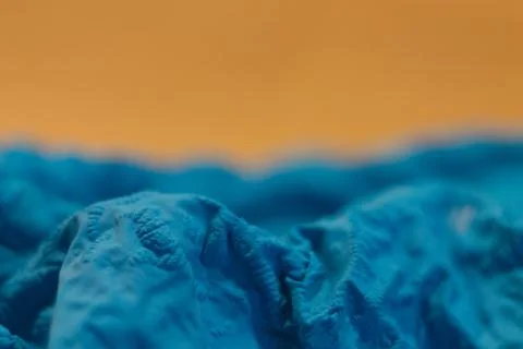 A close-up view of the compressed wrinkled rubber of a blue sea Stock Photos