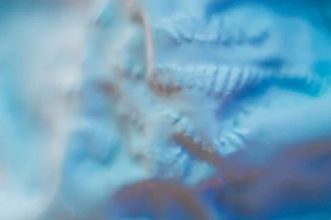 A close-up view of the compressed wrinkled rubber of a blue sea Stock Photos