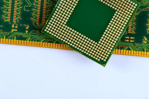 Close up view of computer chip on circuit board with multiple tracks gold pin Stock Photos