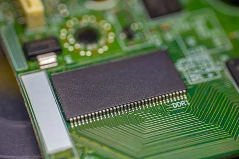 Close-up view of a computer circuit board featuring a black memory chip wit.. Stock Photos