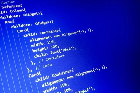 Close-up view of computer code on a blue background, featuring widget 写真素材