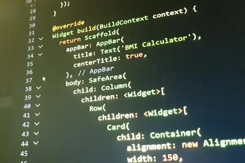 Close-up view of computer code displayed on a screen, revealing programming Stock Photos