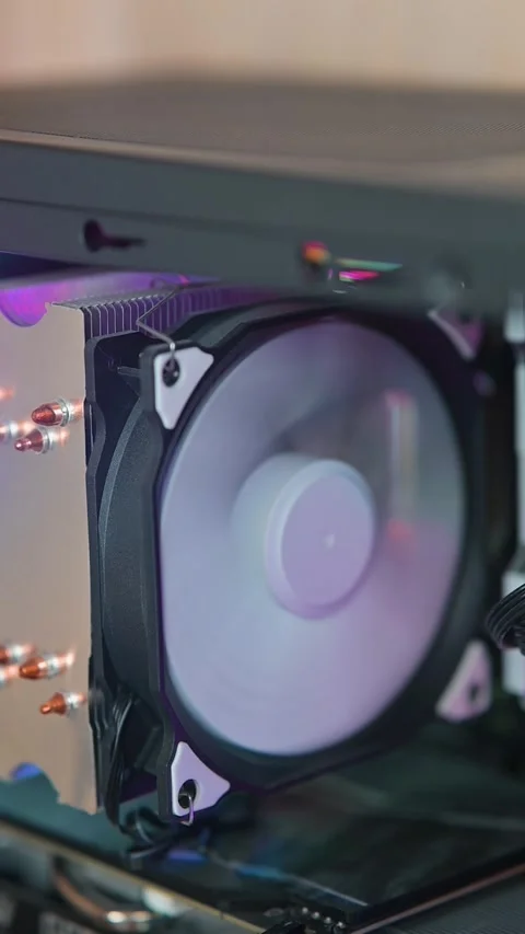 Close-up view of a computer cooling fan spinning. The footage highlights the fan Stockbeeldmateriaal 337112771