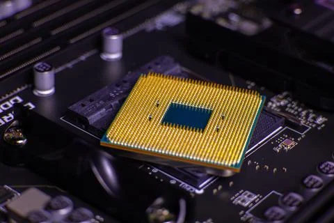 Close up view of a computer CPU placed on a motherboard ready for installation Stock Photos