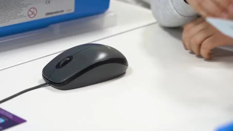 Close up view of a computer gray mouse is lying on the white table Stock Footage 167214894