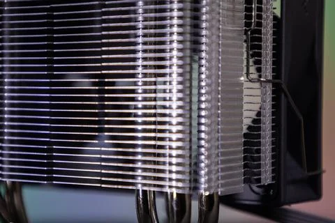 Close view of computer heat sink showing metal fins and pipes on a circuit board Stock Photos