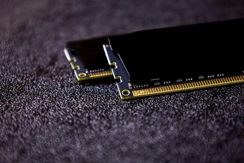 Close-up view of computer memory modules placed on a dark textured surface Stock Photos