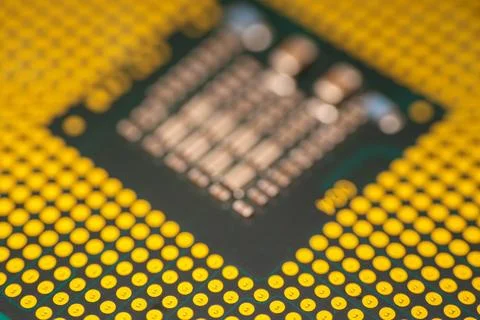 Close-up view of a computer microprocessor with gold pins and intricate cir.. Stock Photos