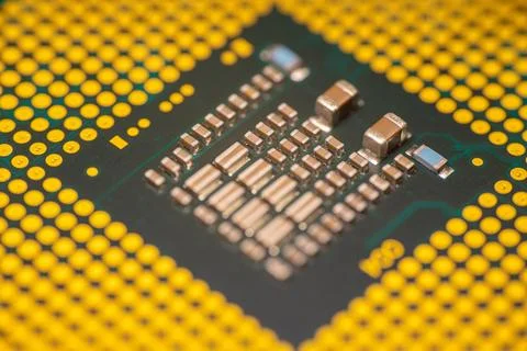 Close-up view of a computer microprocessor with gold pins and intricate cir.. Stock Photos