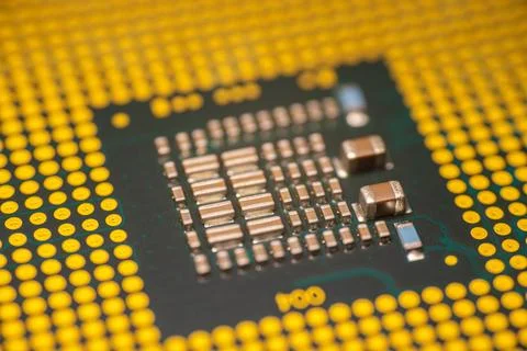 Close-up view of a computer microprocessor with intricate circuitry and gol.. Stock Photos