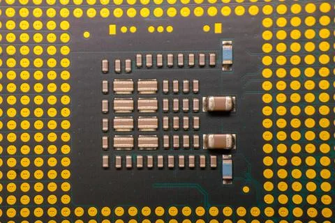 Close-up view of a computer microprocessor with intricate circuitry and gol.. Stock Photos