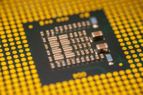 Close-up view of a computer microprocessor with metallic components and yel.. Stock Photos