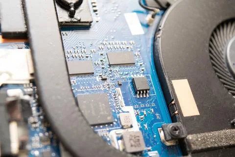 Close-up view of a computer motherboard featuring integrated circuits, capa.. Stock Photos