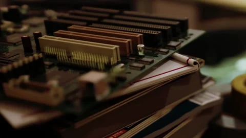Close up View of Computer Motherboard Resting on Books on Table Indoors Stock Footage 348397106
