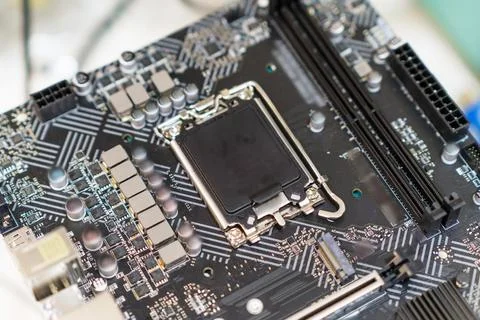 Close-up view of a computer motherboard showcasing intricate circuitry, CPU Stock Photos