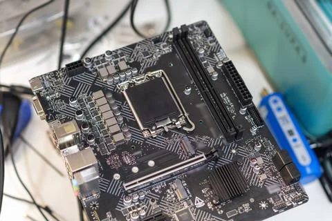 Close-up view of a computer motherboard with various components and circuitry Фото