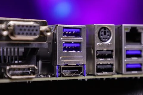 Close view of computer ports and connectors on a motherboard at a tech setup Foto stock