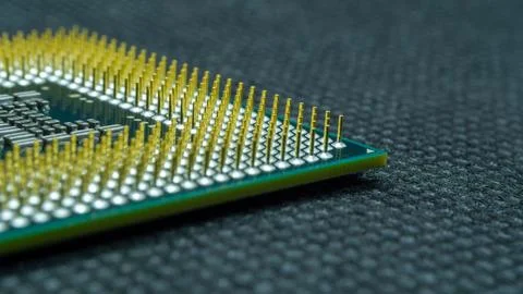 Close-Up View of a Computer Processor Unit on a Dark Textured Surface 写真素材