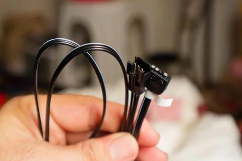 Close-up view of a Computer SATA Cable Connector, showcasing precision and .. Stock Photos