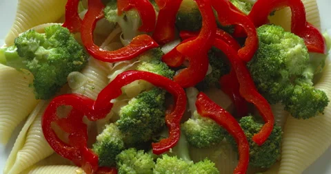Close-up view of conchiglie pasta with broccoli and red pepper. Stock Footage 280107486