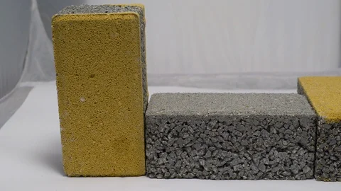 Close-up view of concrete blocks for self-locking paving of roads and sidewal Stock Footage