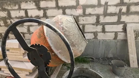 A Close-Up View of a Concrete Mixer Working at a Construction Site, Showcasing Vidéo 342831905