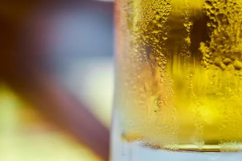 Close-up view of condensation droplets on the side of a cold glass of beer Stock Photos