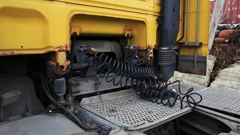 Close up view of connection points and coiled air hoses for braking system of Stock Footage 323367091
