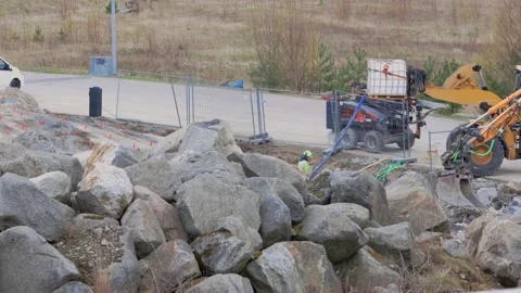 Close up view of construction imploding works on rocky terrain. Stock Footage 154160196