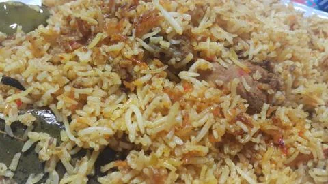 A close up  view of cooked rice chicken biryani made with traditional recipe  Stock Photos