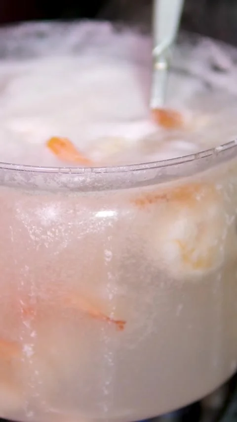 Close up view on cooking prawns or shrimps. Boiling of prawns or shrimps in Stock Footage 302076727