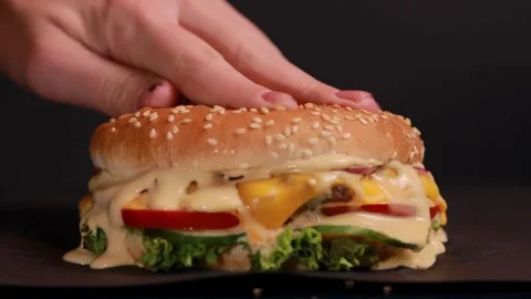 Close-up view Cool beautiful fresh juicy cooked burger rotate on turntable, Stock Footage 336579584
