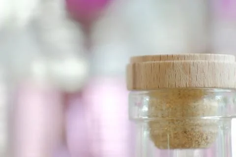 Close view of corked bottle top with pastel pink background Stock Photos