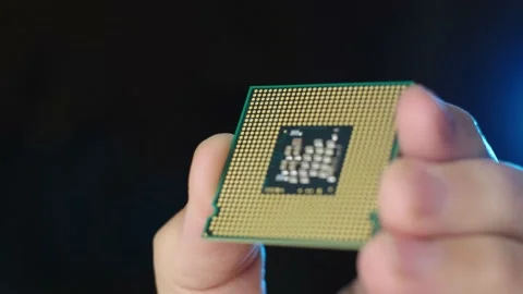 Close up view CPU processor hold by technician, Rack focus black background Stock Footage 170458716