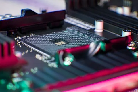 Close-up view of cpu socket on computer motherboard with rgb lighting Stock Photos