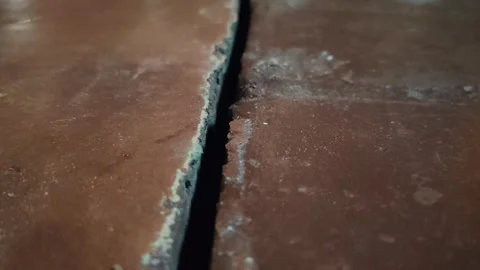 Close-up view of cracked solid surface showing detailed textures Stock Footage 320189807