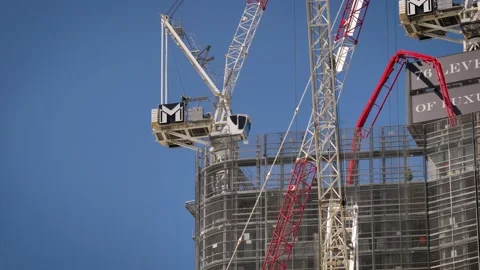 Close view of cranes on a construction site on the Esplanade, Surfers Paradise. Видео 332560048