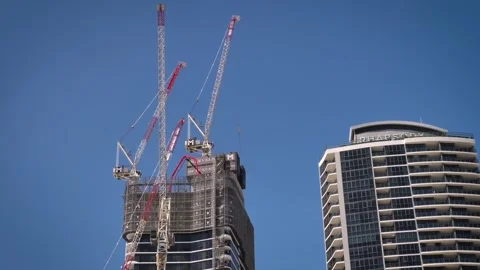 Close view of cranes on a construction site on the Esplanade, Surfers Paradise. Video stock 332561821