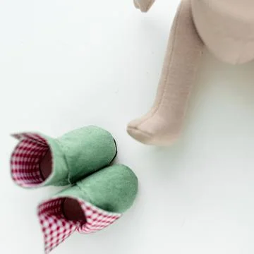 Close-up view on the creative process of sewing doll, details of doll cloth 스톡 사진