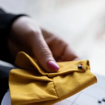 Close-up view on the creative process of sewing doll, details of doll cloth Foto stock