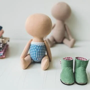 Close-up view on the creative process of sewing doll, details of doll cloth 스톡 사진
