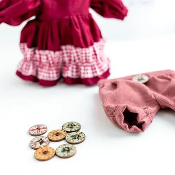 Close-up view on the creative process of sewing doll, details of doll cloth 스톡 사진