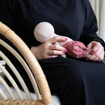 Close-up view on the creative process of sewing doll, details of doll cloth Foto stock