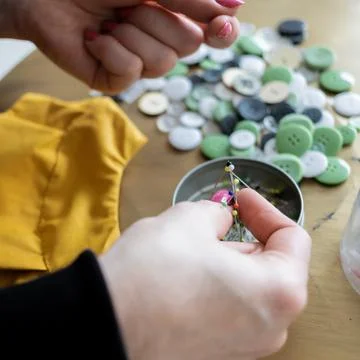 Close-up view on the creative process of sewing doll, details of doll cloth 스톡 사진