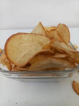 Close Up View of Crispy Cassava Chips inside Glass Bowl Stock Photos