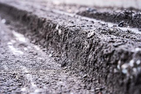 A close view of a cross-section of the old road surfac. repair Stock Photos