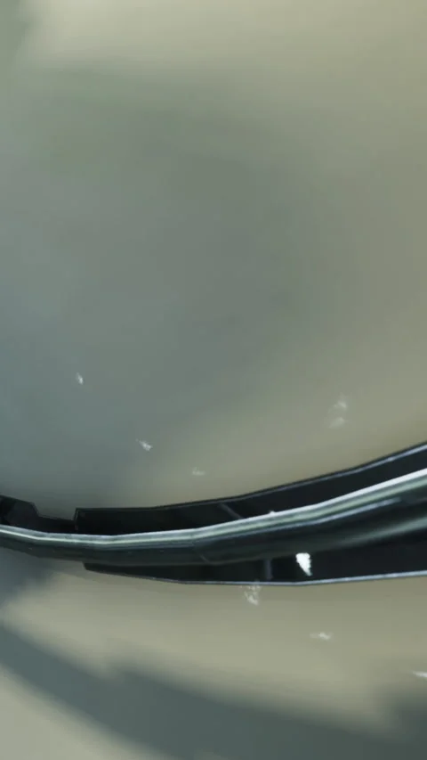 Close view of a curved metallic surface and its round border in a garage Stock Footage 335947627
